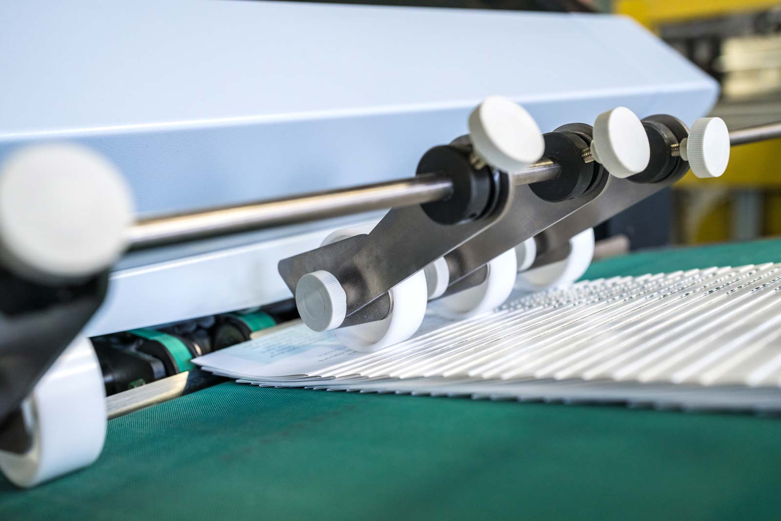 Our printer folds saddle stitch booklets for mass production